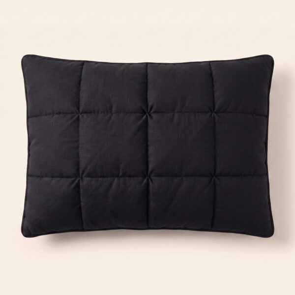 Direct overhead top view of The Black Pillow Original showcasing its symmetrical minimalist grid tufting pattern.